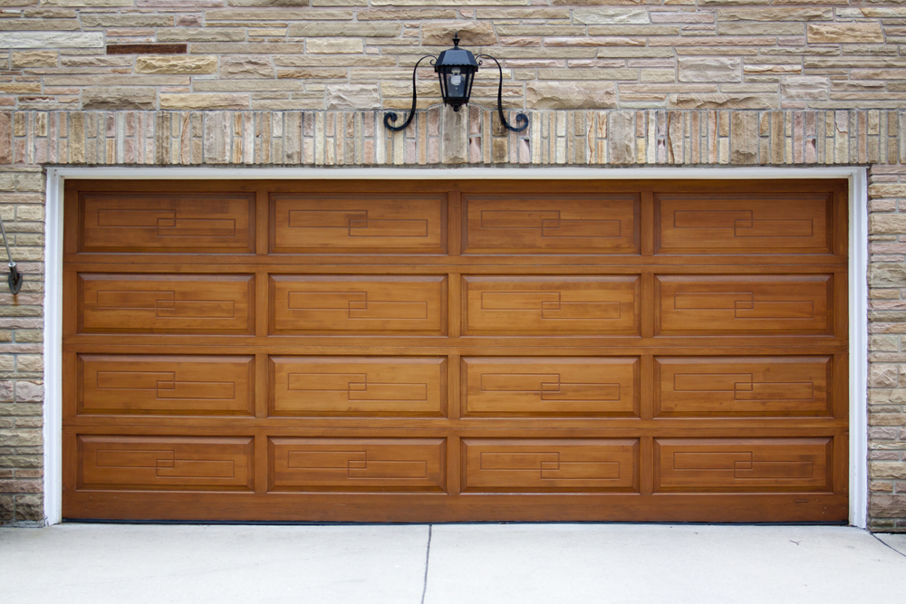 Wood garage door with raised panels