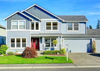 Blue house with matching garage door